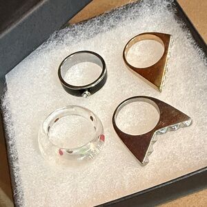 Set of Four Stylish Rings in Black, Gold, Silver, and Clear🌟